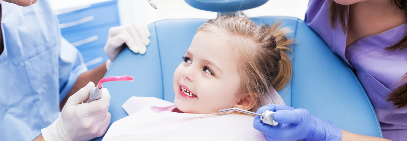 young girl at a dentist appointment, pediatric dental emergency
