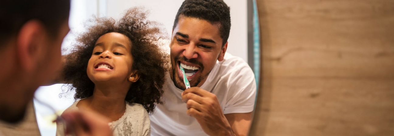 family brushing their teeth, good pediatric dental care
