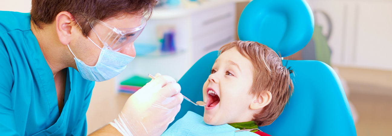 child visits pediatric dentist for orthodontic evaluation